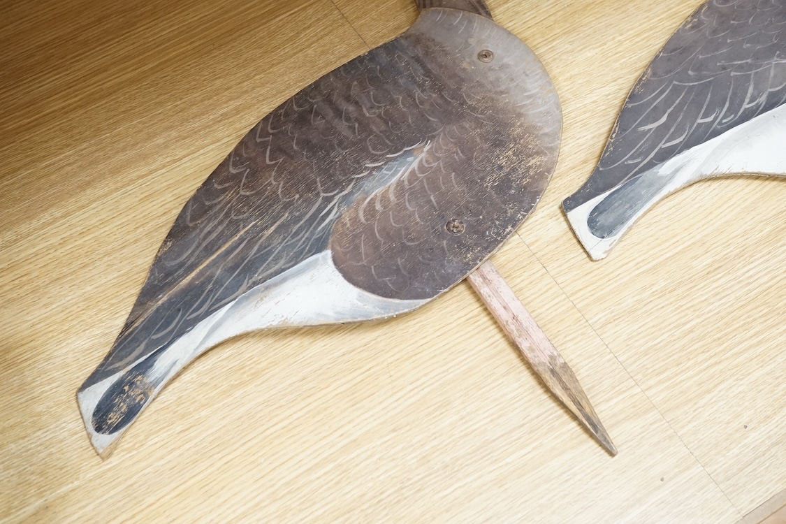 A pair of painted ply 'goose' profile decoys, 58cm high